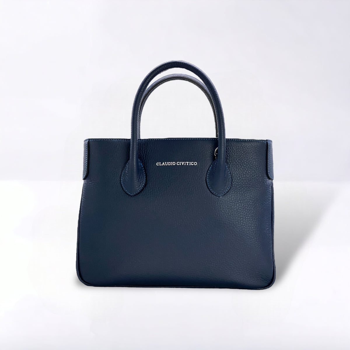 Monedero Satchel azul con herrajes plateados